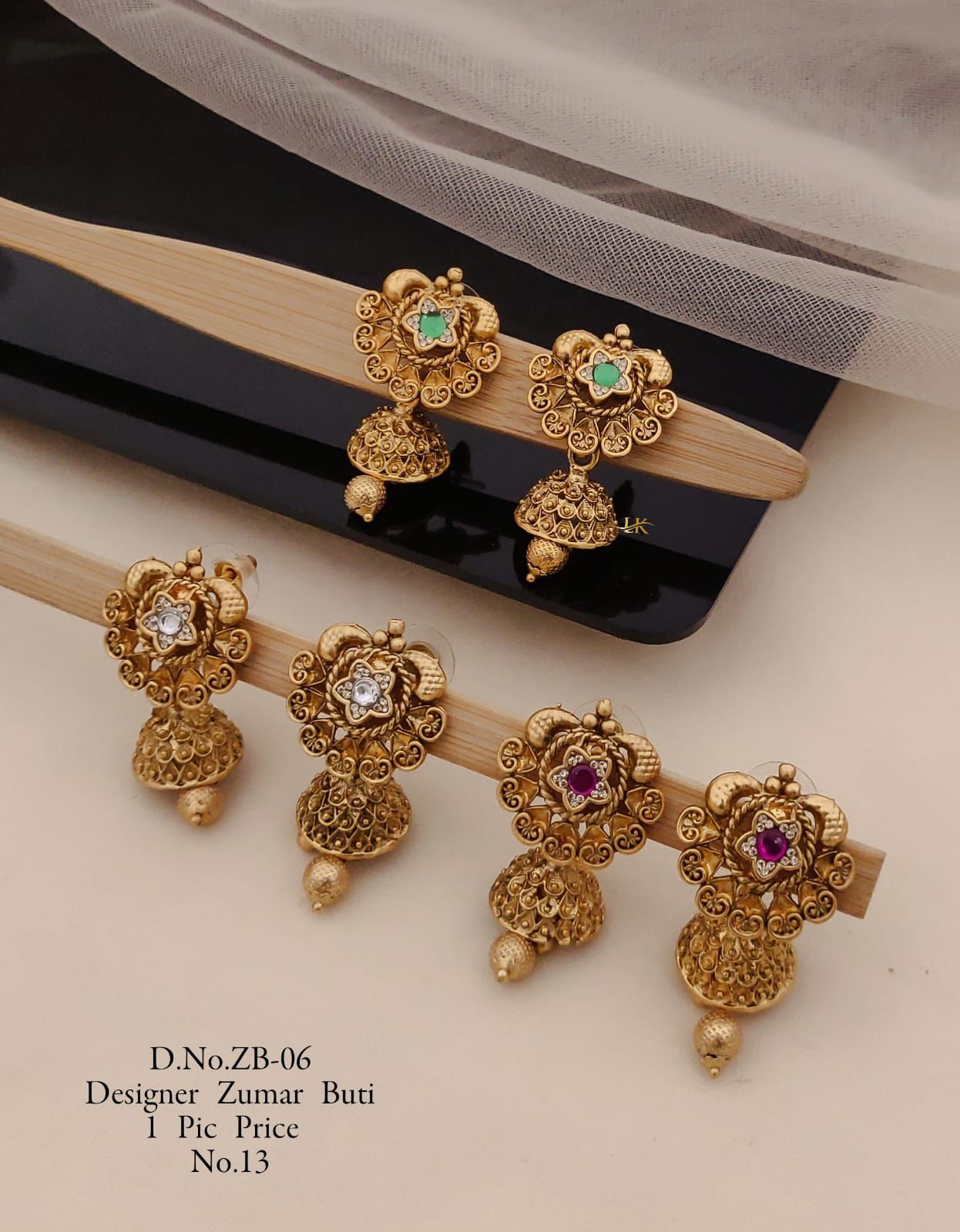 Golden Jhumka Elegance: Traditional Craftsmanship for Modern Celebrations.